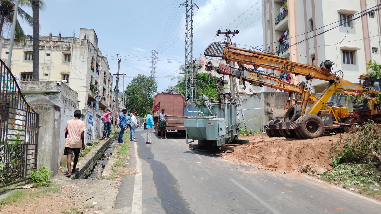Power transformer being positioned roadside using a mobile crane