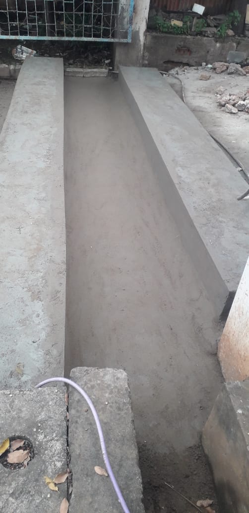 Finished smooth concrete underground cable trench channel between two RCC walls